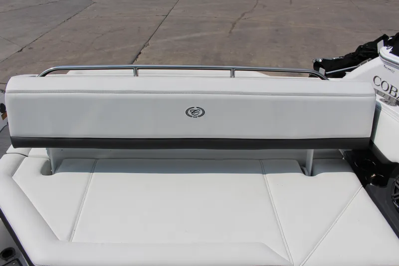 Slide: The Image of Rear seating of 2025 Cobalt R8 boat with white upholstery and logo. - 32