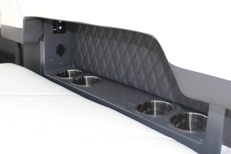 Slide: The Image of Interior of 2025 Cobalt R8 featuring cup holders and quilted panel design. - 34