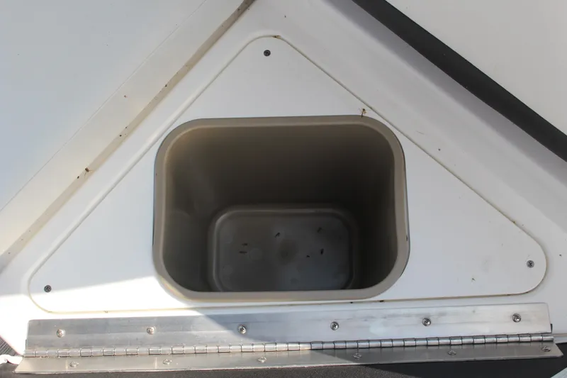 Slide: The Image of Storage compartment in 2025 Cobalt R8 boat, featuring a rectangular recessed design. - 35