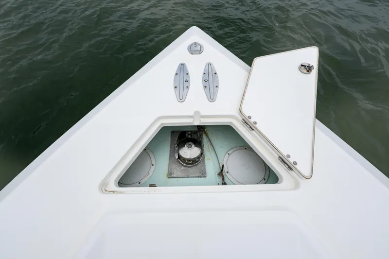 Slide: The Image of Bow of 2008 Venture 39 Cuddy boat with open anchor hatch. - 30