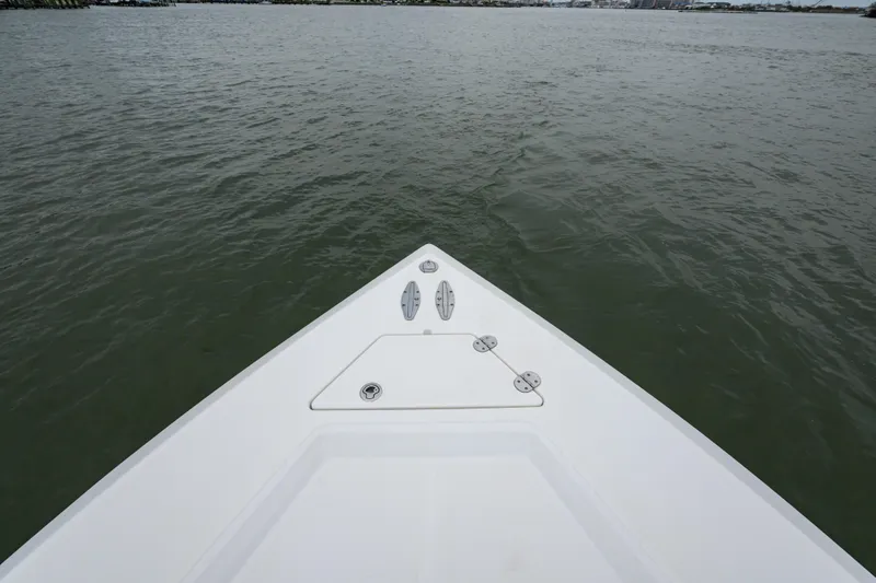 Slide: The Image of Bow view of 2008 Venture 39 Cuddy boat on calm water. - 29