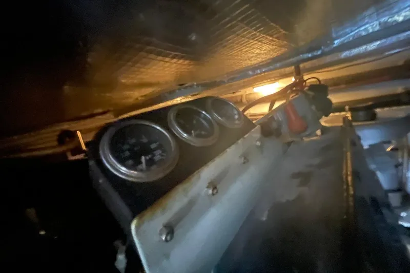 Slide: The Image of Engine room of 1998 Sea Ray 480 Sedan Bridge with gauges and wiring. - 104