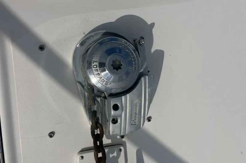Slide: The Image of Anchor windlass on 1998 Sea Ray 480 Sedan Bridge boat deck. - 26