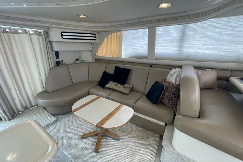 Slide: The Image of Luxurious interior of 1998 Sea Ray 480 Sedan Bridge yacht with plush seating and elegant decor. - 36