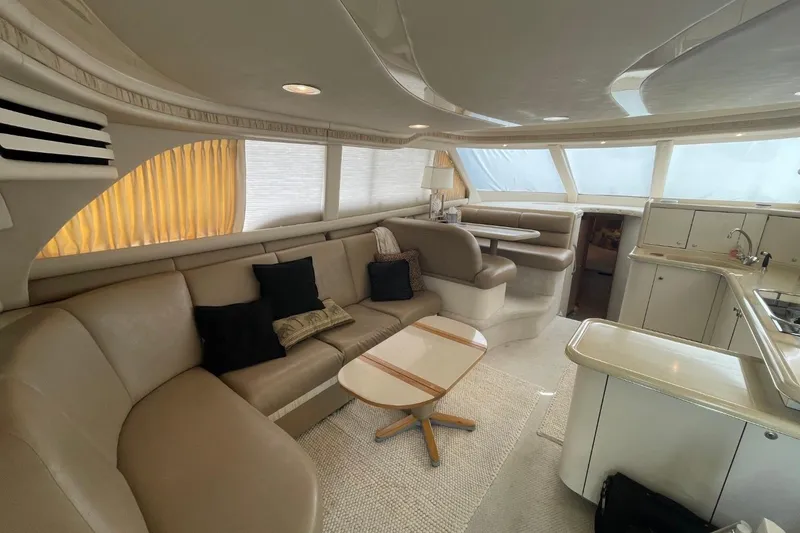 Slide: The Image of Luxurious interior of a 1998 Sea Ray 480 Sedan Bridge yacht with elegant seating and modern amenities. - 37
