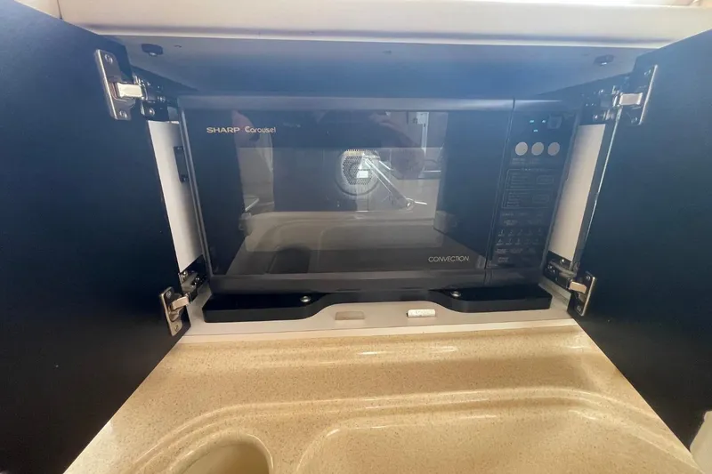 Slide: The Image of Sharp Carousel convection microwave in 1998 Sea Ray 480 Sedan Bridge kitchen. - 42