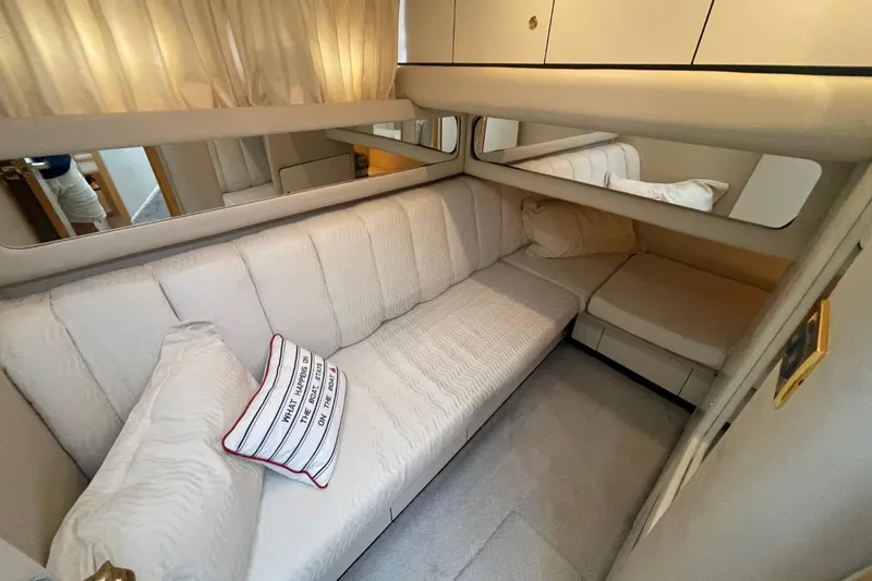 Slide: The Image of Luxurious interior of 1998 Sea Ray 480 Sedan Bridge yacht with comfortable seating. - 44