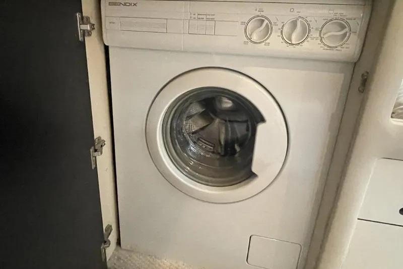 Slide: The Image of Washing machine inside 1998 Sea Ray 480 Sedan Bridge yacht cabin. - 47