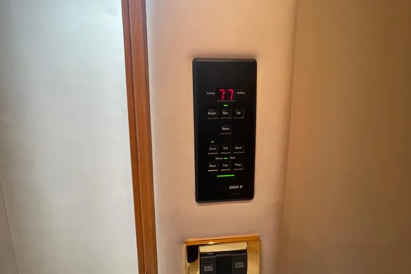 Slide: The Image of Thermostat control panel on 1998 Sea Ray 480 Sedan Bridge yacht interior. - 51