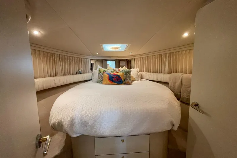 Slide: The Image of Luxurious bedroom interior of 1998 Sea Ray 480 Sedan Bridge yacht. - 54