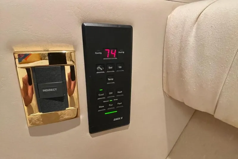 Slide: The Image of Control panel on a 1998 Sea Ray 480 Sedan Bridge yacht interior. - 59