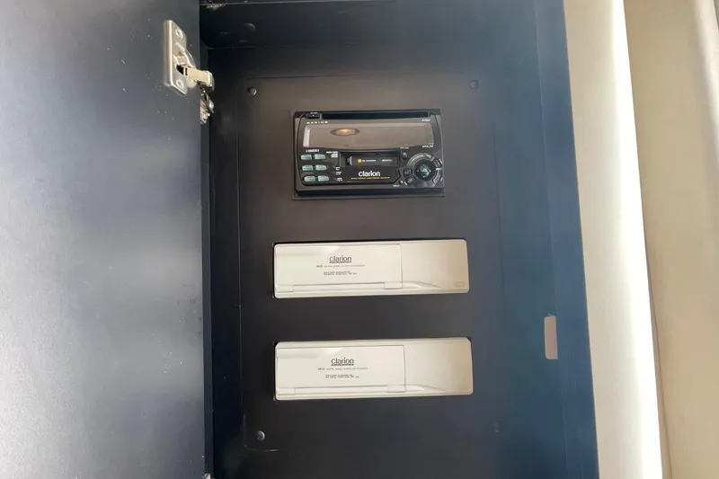 Slide: The Image of 1998 Sea Ray 480 Sedan Bridge audio system with Clarion stereo and components. - 64