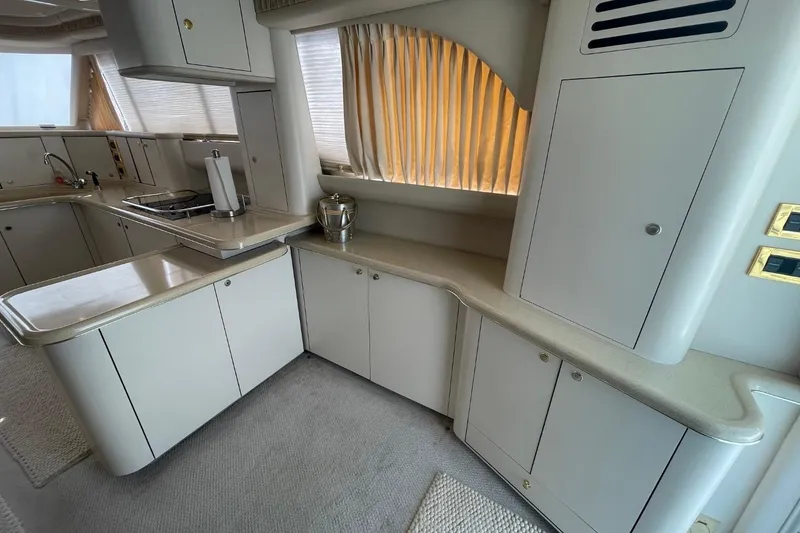 Slide: The Image of Luxurious kitchen interior of 1998 Sea Ray 480 Sedan Bridge yacht. - 65