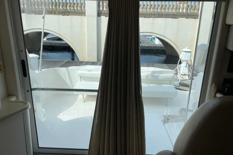 Slide: The Image of Interior view of 1998 Sea Ray 480 Sedan Bridge yacht, showing deck and bridge outside. - 68