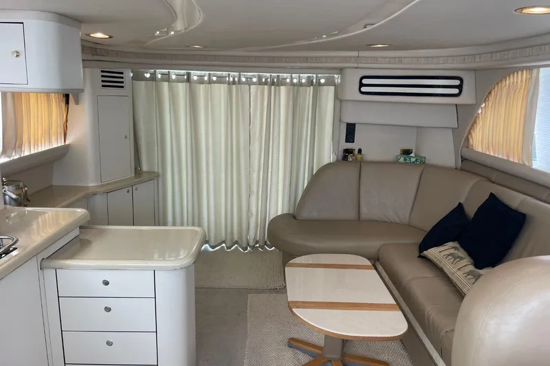 Slide: The Image of Luxurious interior of 1998 Sea Ray 480 Sedan Bridge yacht with modern furnishings. - 69