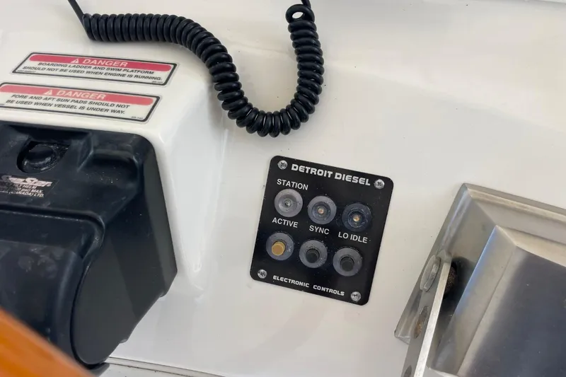 Slide: The Image of Control panel of a 1998 Sea Ray 480 Sedan Bridge with Detroit Diesel electronic controls. - 72
