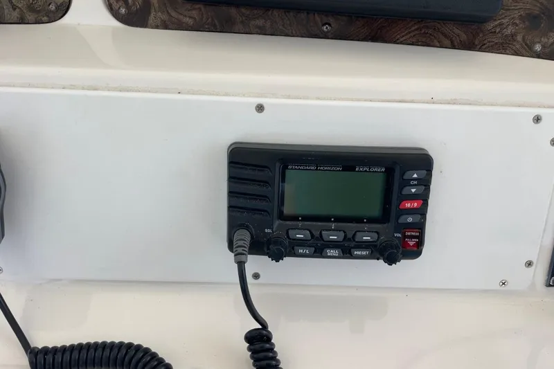 Slide: The Image of VHF radio on 1998 Sea Ray 480 Sedan Bridge boat dashboard. - 73