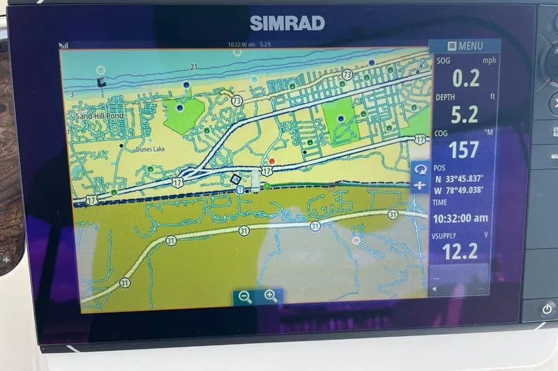 Slide: The Image of Simrad navigation display on 1998 Sea Ray 480 Sedan Bridge, showing map and coordinates. - 76