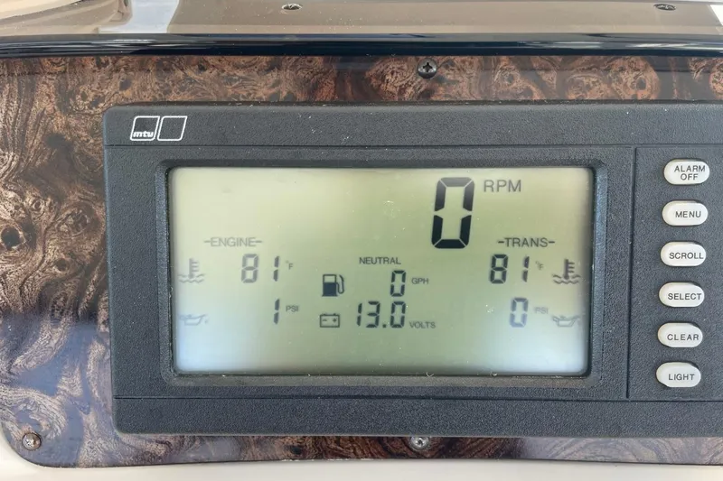 Slide: The Image of Dashboard display of a 1998 Sea Ray 480 Sedan Bridge showing engine and transmission data. - 77