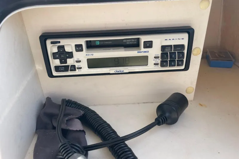 Slide: The Image of Marine radio system on 1998 Sea Ray 480 Sedan Bridge boat dashboard. - 81