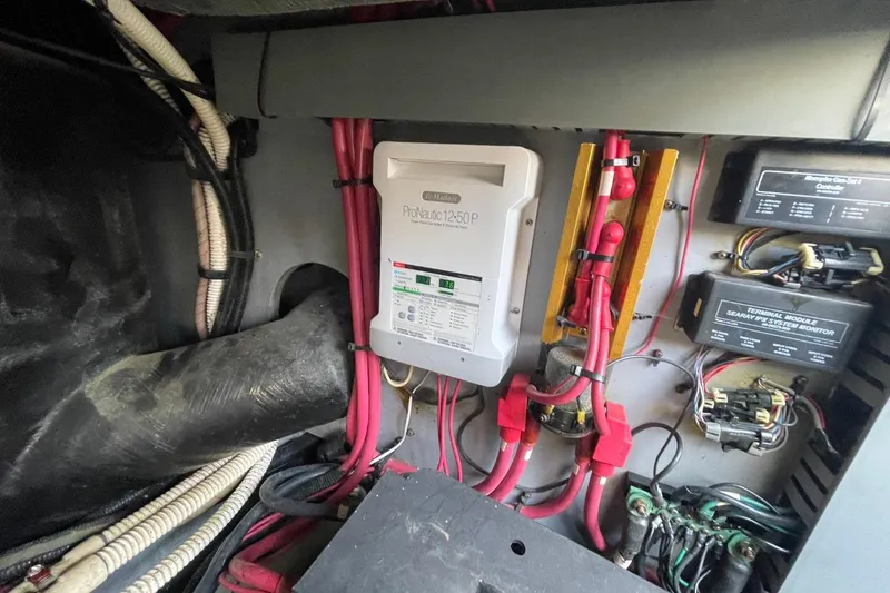 Slide: The Image of Electrical system of a 1998 Sea Ray 480 Sedan Bridge boat, featuring wiring and control modules. - 86