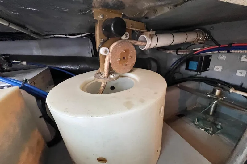 Slide: The Image of Engine room of 1998 Sea Ray 480 Sedan Bridge with visible components and wiring. - 89