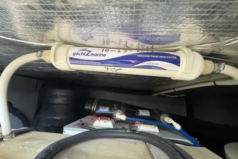 Slide: The Image of Holding tank vent filter in 1998 Sea Ray 480 Sedan Bridge yacht engine room. - 90