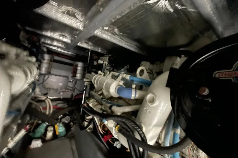 Slide: The Image of Engine room of 1998 Sea Ray 480 Sedan Bridge with visible components and wiring. - 95
