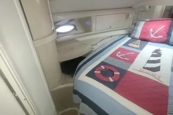 Slide: The Image of Interior cabin of 2000 Doral 360 SE boat with nautical-themed bedding. - 11