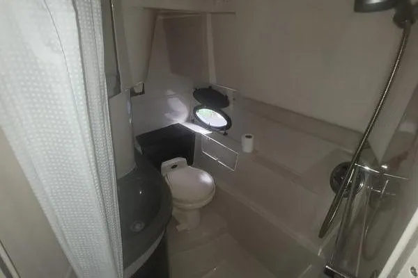 Slide: The Image of Bathroom interior of 2000 Doral 360 SE boat with shower and toilet. - 15