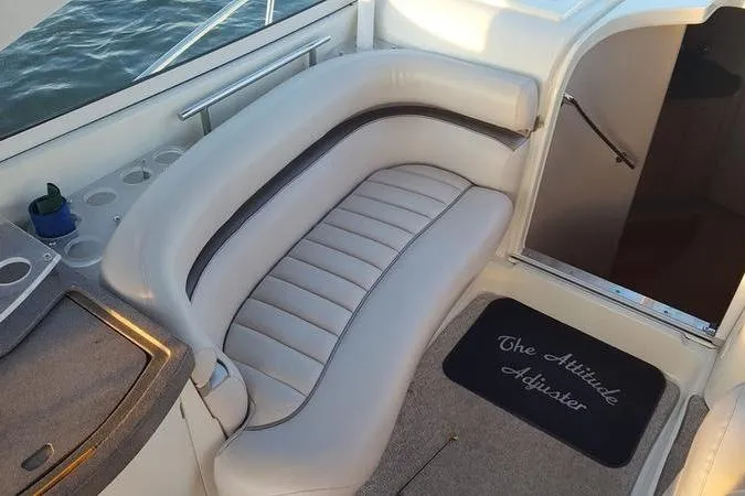 Slide: The Image of Interior of 2000 Doral 360 SE boat with cushioned seating and custom mat. - 19