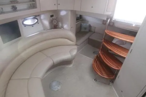 Slide: The Image of Interior of 2000 Doral 360 SE yacht with curved seating and wooden steps. - 20