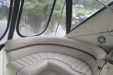 Slide: The Image of Interior of a 2000 Doral 360 SE boat with curved seating and window view. - 22