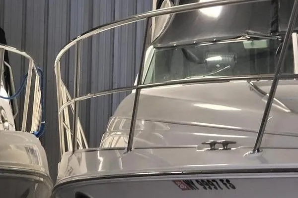 Slide: The Image of 2000 Doral 360 SE boat in storage, featuring sleek design and stainless steel railings. - 24