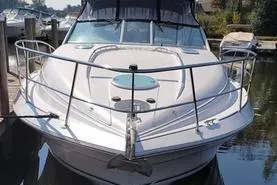 Slide: The Image of Front view of a 2000 Doral 360 SE boat docked in a marina. - 3