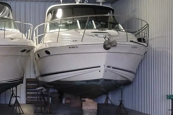 Slide: The Image of 2000 Doral 360 SE boat stored indoors, elevated on stands. - 4