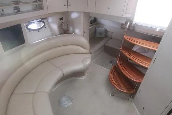 Slide: The Image of Interior of 2000 Doral 360 SE yacht with curved seating and wooden steps. - 6