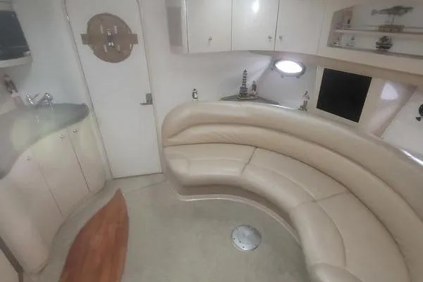 Slide: The Image of Interior of 2000 Doral 360 SE yacht with curved seating and modern amenities. - 7