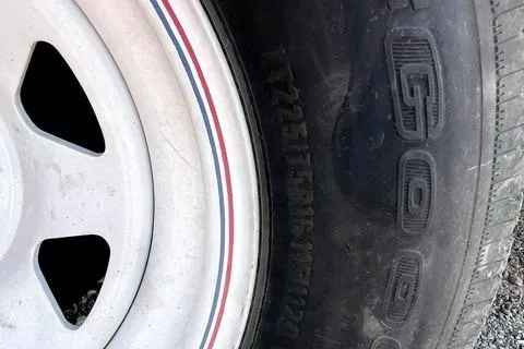 Slide: The Image of Close-up of a Wellcraft Scarab 38 tire, showcasing tread and rim details. - 11