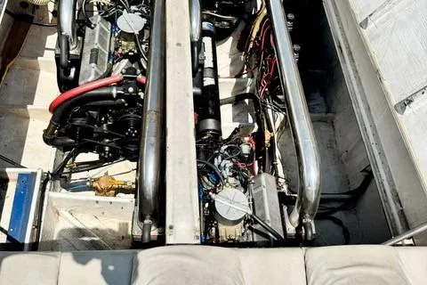 Slide: The Image of Engine compartment of a 1979 Wellcraft Scarab 38 boat, showcasing dual engines and mechanical components. - 23