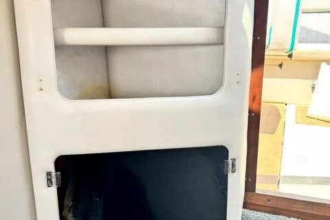 Slide: The Image of 1979 Wellcraft Scarab 38 interior cabin detail with storage compartments. - 7
