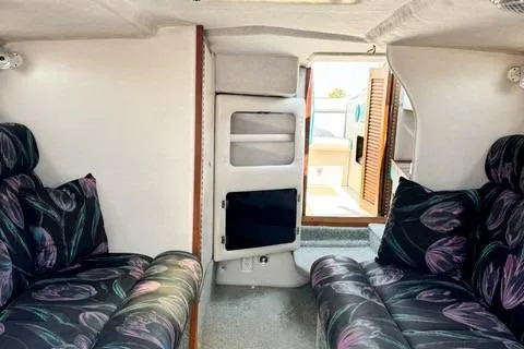 Slide: The Image of Interior of a 1979 Wellcraft Scarab 38 boat with floral-patterned seating. - 8