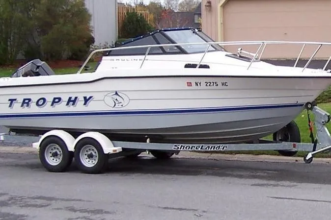 Slide: The Image of Boat on trailer, 1993 Trophy 2002 Wa model, parked outdoors. - 6