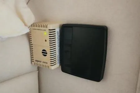 Slide: The Image of Carbon monoxide detector and control panel inside 2002 Sea Ray 260 Sundancer boat. - 35