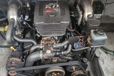 Slide: The Image of Engine of a 2002 Sea Ray 260 Sundancer boat, showcasing mechanical components. - 39