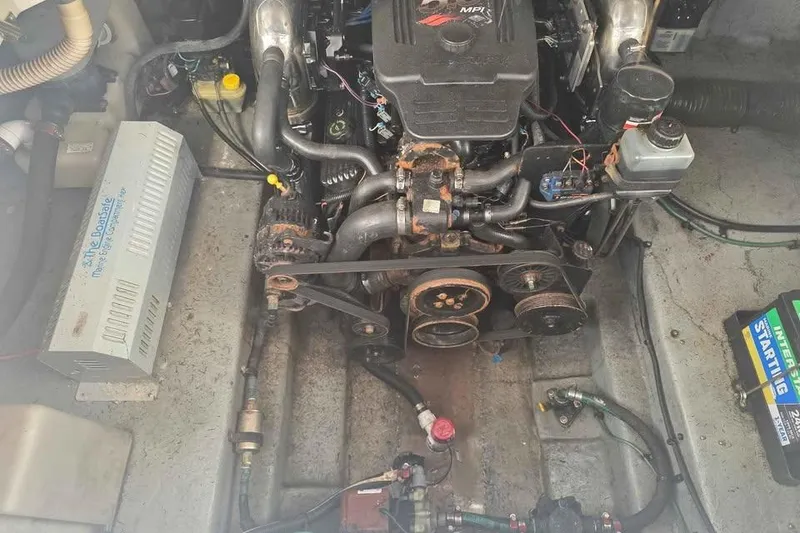 Slide: The Image of Engine compartment of a 2002 Sea Ray 260 Sundancer boat, showing mechanical components. - 40