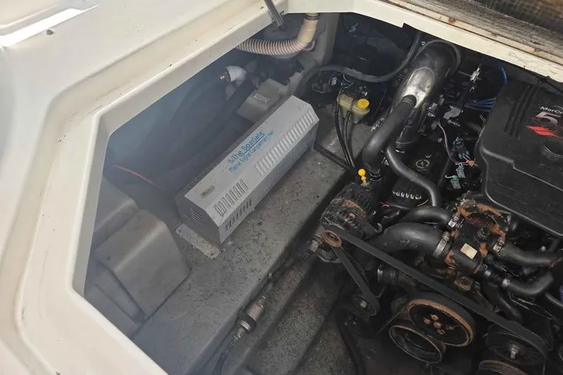 Slide: The Image of Engine compartment of a 2002 Sea Ray 260 Sundancer boat, showing mechanical components. - 41