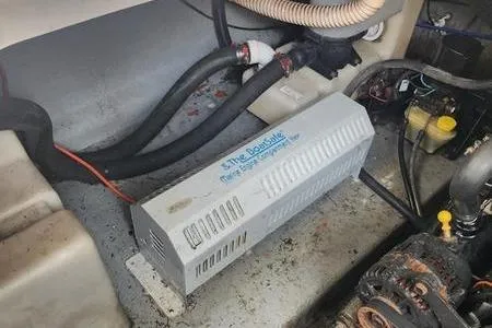 Slide: The Image of 2002 Sea Ray 260 Sundancer engine compartment with marine equipment and wiring. - 44