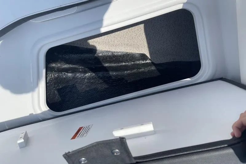 Slide: The Image of Open storage compartment in 2025 Stingray 182C boat, showcasing interior space. - 12