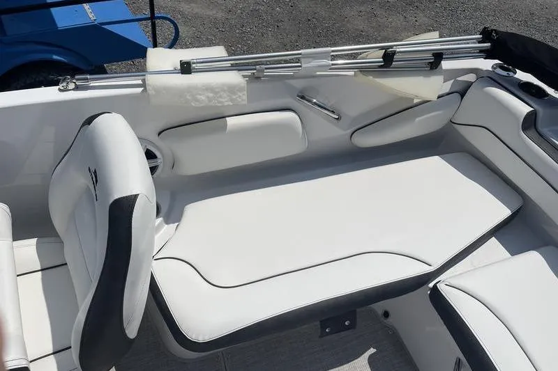Slide: The Image of Interior seating of 2025 Stingray 182C boat with white upholstery and sleek design. - 16